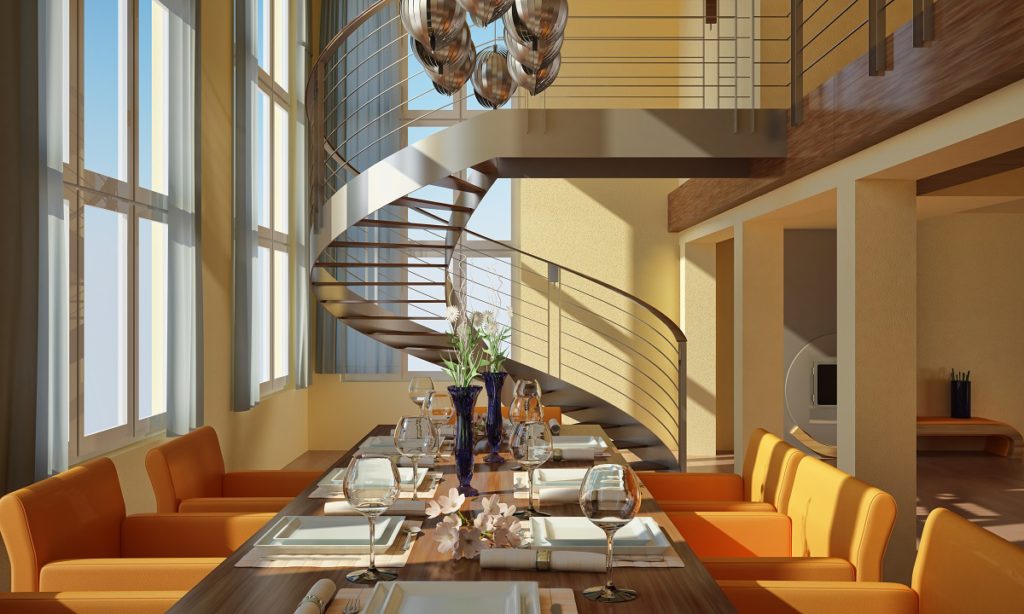 Modern dining room with wide windows and spiral staircase.
